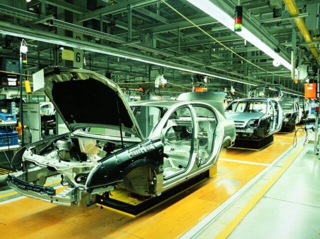 8406198 - unfinished automobiles in a car plant