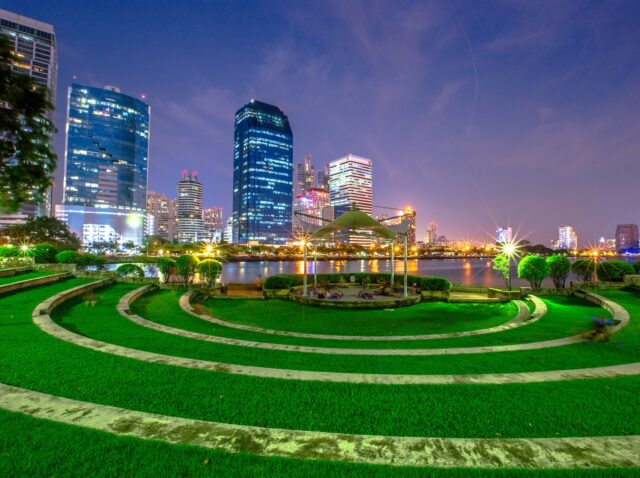 Night lights at the park in the heart of Bangkok. People have to sit and relax. Take a break before returning to your accommodation or talk to a friend (Benjakitti Park)