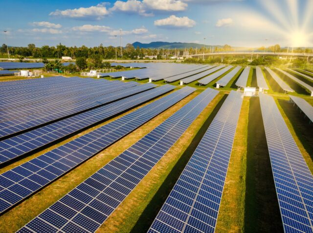 Sun power solar panel field in Thailand in the evening light during sunset. Sun energy green energy transition in Thailand