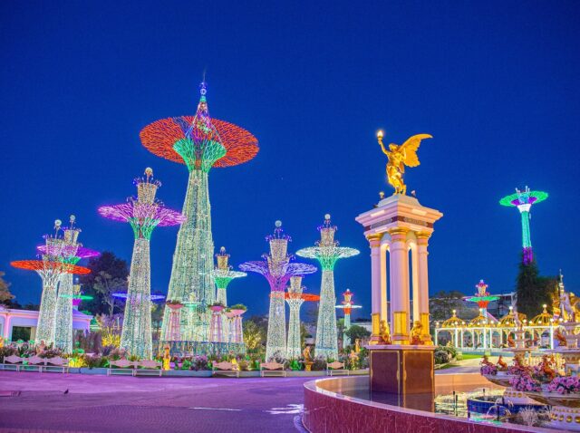 Baan Sukhawadee Mansion, Pattaya, Thailand, 5 February 2024 : the colourful night light decoration huge mansion for tourists to visit. Located at eastern Thailand.