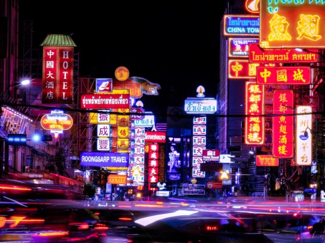 Bangkok, Thailand - July 11, 2019: Colorful signs and the light trails from cars moving on the night of Yaowarat Road at main street in Bangkok's Chinatown