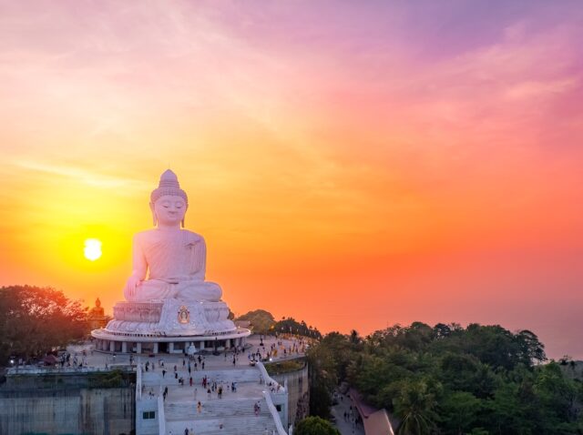 Aerial top view Big Buddha statue on hilltop of Phuket Thailand on sunset.