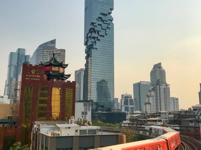 BTS metro passes by the King Power Mahanakhon Building in Bangkok, Thailand on February 19, 2020