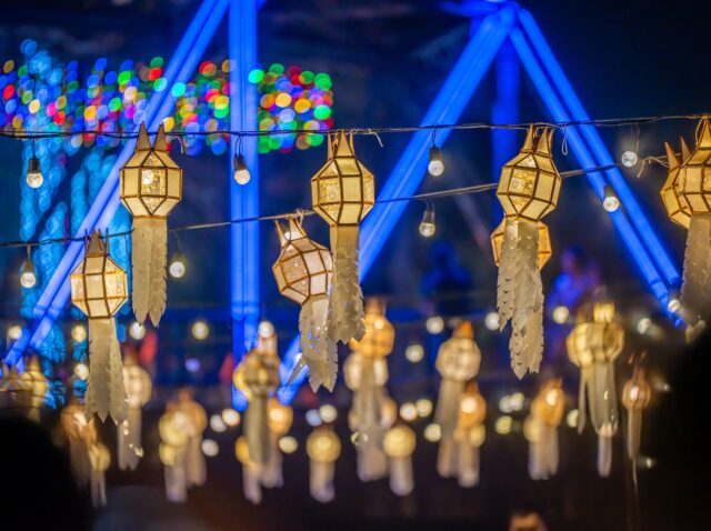 fireworks show at iron bridge across ping river where decorate with a lot of colorful light lanterns is highlight of yee peng loy krathong festival chiangmai thailand November 2024